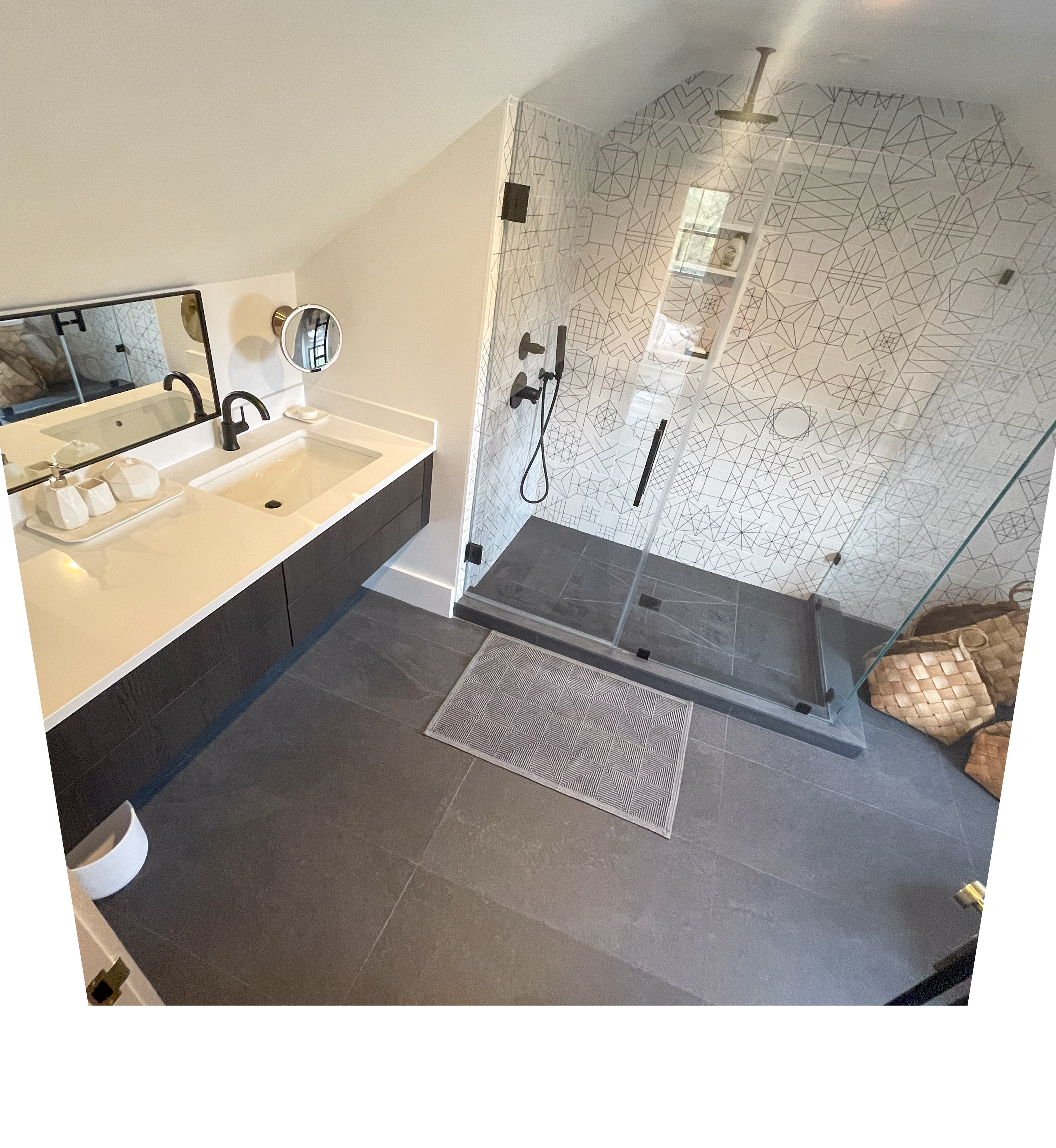 Guest bathroom with graphic geometric tile shower and slate floors